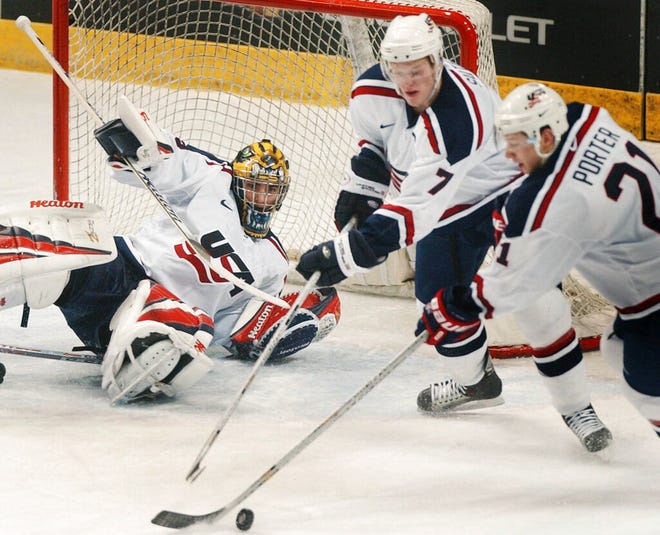 U.S. defenders Ryan Suter (7) and Kevin Porter (21) clear the puck from in front of goalie Al Montoya (29) during the second period against Russia in the preliminary round of the 2004 World Junior Hockey Championship at Ralph Engelstad Arena in Grand Forks, N.D.