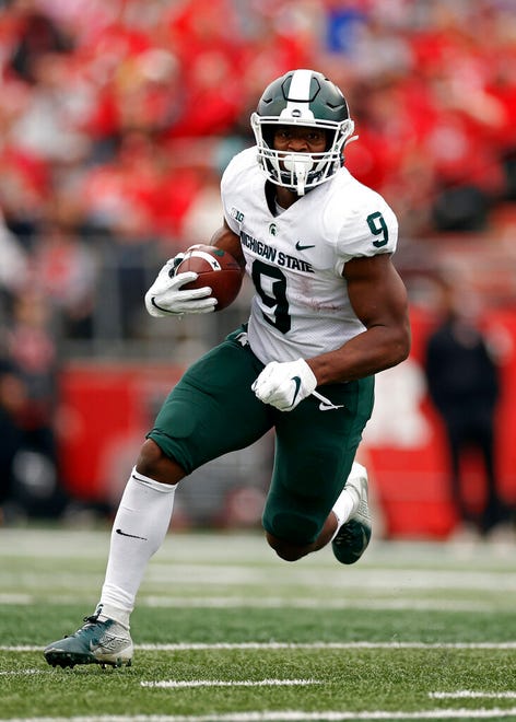 Michigan State running back Kenneth Walker III rushes against Rutgers during the first half.