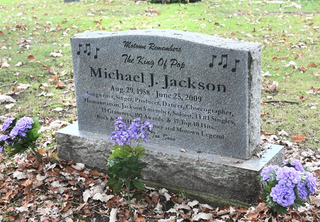 A headstone for the King of Pop Michael Jackson is seen at Woodlawn Cemetery during a tour in Detroit on Saturday, October 9, 2021.