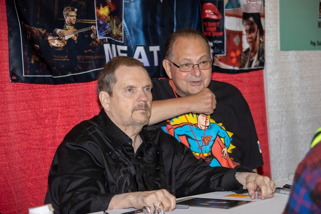 Michael Lee Aday, better known as Meat Loaf, poses for a picture with fan Gary Smith, right, of Lauren, Ohio, during the Motor City Comic Con event.