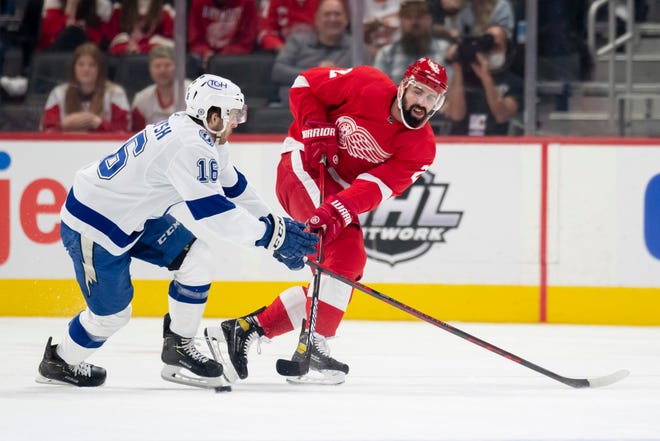 Red Wings defenseman Nick Leddy passes the puck away from Lightning right wing Taylor Raddysh during the first period.