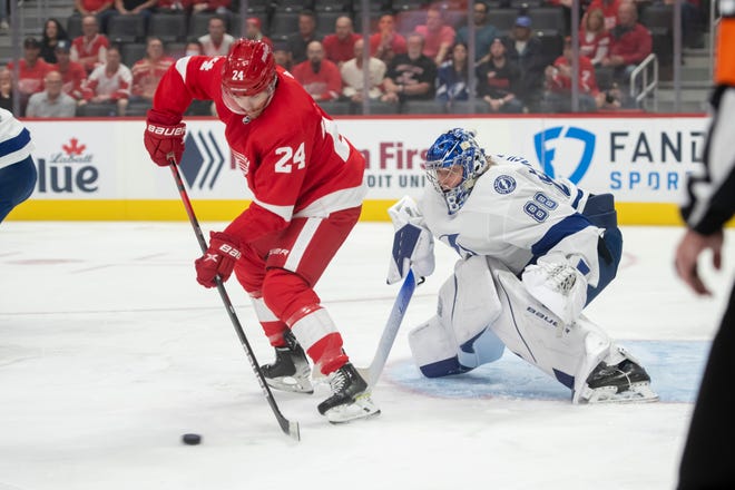Red Wings center Pius Suter tries to get the puck past Lightning goaltender Andrei Vasilevskiy during the first period.
