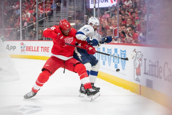 Red Wings defenseman Marc Staal and Lightning left wing Alex Killorn battle for the puck during the second period.