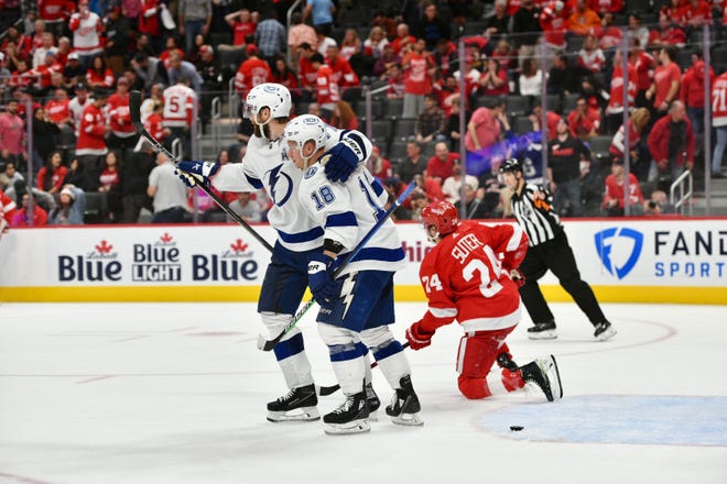 Lightning players celebrate their 7-6 win over the Red Wings in overtime.