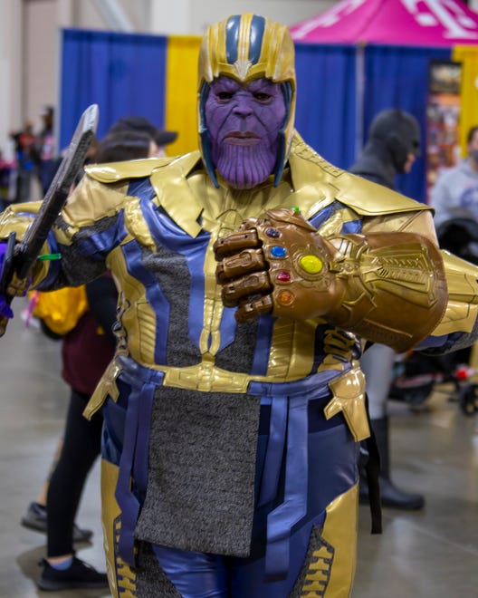 A fan poses as Thanos during the Motor City Comic Con event in Novi, Friday.