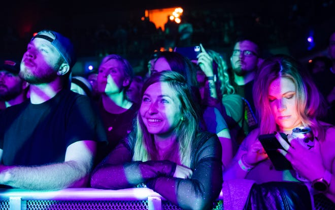 Fans enjoy the alternative rock music of Thrice from the front row at St. Andrews Hall in Detroit.