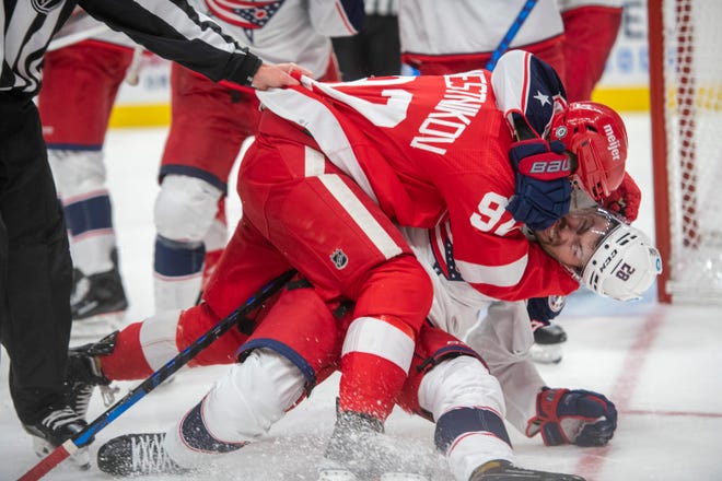 Detroit center Vladislav Namestnikov and Columbus right wing Oliver Bjorkstrand get into a fight during the third period of a game between the Detroit Red Wings and the Columbus Blue Jackets at Little Caesars Arena, in Detroit, October 19, 2021.