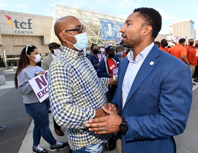 Jimmy Womack, left, of Detroit, former MI State Rep. and former Detroit School Board President shakes hands with MI State Senator Adam Hollier before the event, Wednesday afternoon, October 20, 2021. 
Members of the public speak during the Michigan Independent Citizens Redistricting Commission's public hearing at TCF Center in Detroit. People voice their concerns with the current redistricting maps and urge the commission to do better and the proposed maps for state House, state Senate and Congressional districts.