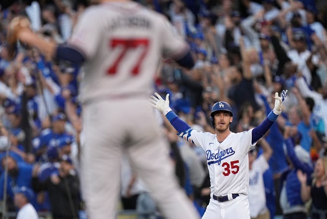 Los Angeles Dodgers center fielder Cody Bellinger reacts after hitting a three-run home run during the eighth inning in Game 3 of baseball's National League Championship Series against the Atlanta Braves Tuesday, Oct. 19, 2021, in Los Angeles.