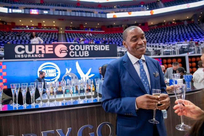 Former Detroit Pistons Isiah Thomas chats at a courtside bar before the start of the Detroit Pistons’ season home opener against the Chicago Bulls.