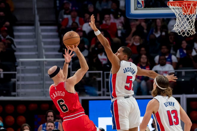 Detroit guard Frank Jackson tries to block a shot by Chicago guard Alex Caruso during the third quarter.