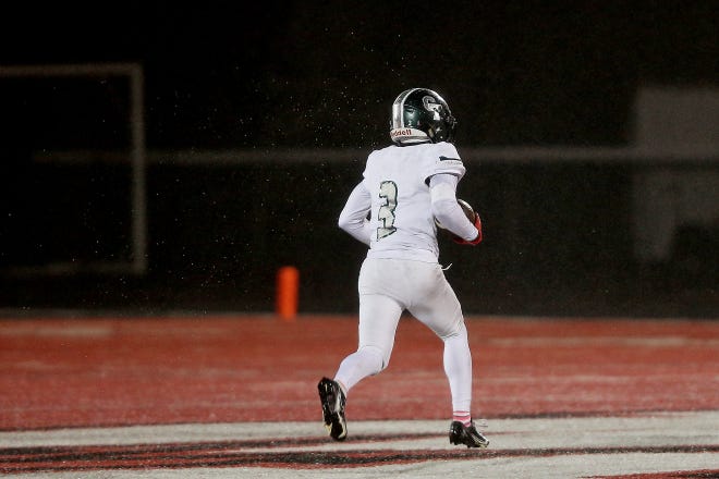 Detroit Cass Tech’s Javen Sewell (3) returns an interception during their high school football game against Orchard Lake St. Mary’s on Thursday, October 21, 2021 at Orchard Lake St. Mary's High School in West Bloomfield Township.