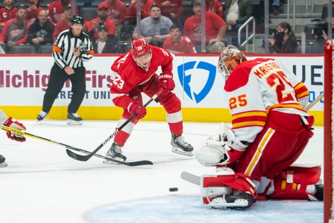 Detroit left wing Lucas Raymond tries to score on Calgary goaltender Jacob Markstrom during the first period of a game between the Detroit Red Wings and the Calgary Flames, at Little Caesars Arena, in Detroit, October 21, 2021.