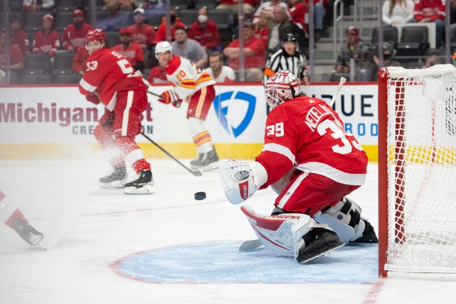 Detroit goaltender Alex Nedeljkovic makes a save during the second period of a game between the Detroit Red Wings and the Calgary Flames, at Little Caesars Arena, in Detroit, October 21, 2021.