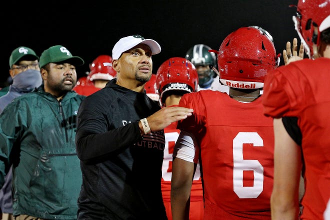 Detroit Cass Tech coach Marvin Rushing walks through the handshake line after Cass Tech defeated Orchard Lake St. Mary’s, 40-7, Thursday, October 21, 2021 at Orchard Lake St. Mary's High School in West Bloomfield Township.