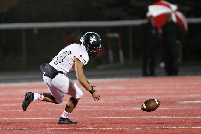 Detroit Cass Tech’s Pierce Clark (24) tries to chase down the ball after an errant snap on a field goal attempt during their high school football game against Orchard Lake St. Mary’s on Thursday, October 21, 2021 at Orchard Lake St. Mary's High School in West Bloomfield Township.