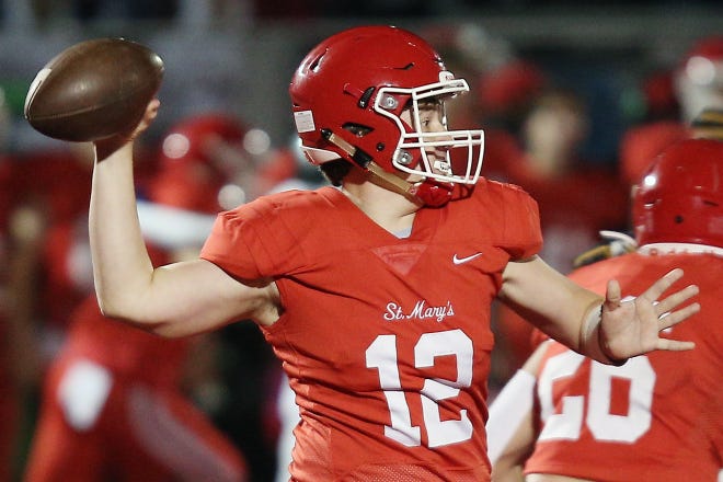 Orchard Lake St. Mary's Brayden Ledin (12) throws a pass during their high school football game against Detroit Cass Tech on Thursday, October 21, 2021 at Orchard Lake St. Mary's High School in West Bloomfield Township.