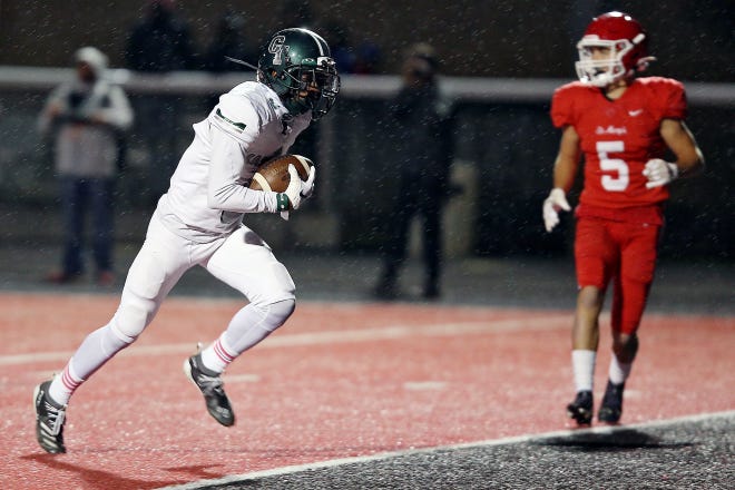 Detroit Cass Tech’s Latrell White (8) runs in for a touchdown during their high school football game against Orchard Lake St. Mary’s on Thursday, October 21, 2021 at Orchard Lake St. Mary's High School in West Bloomfield Township.