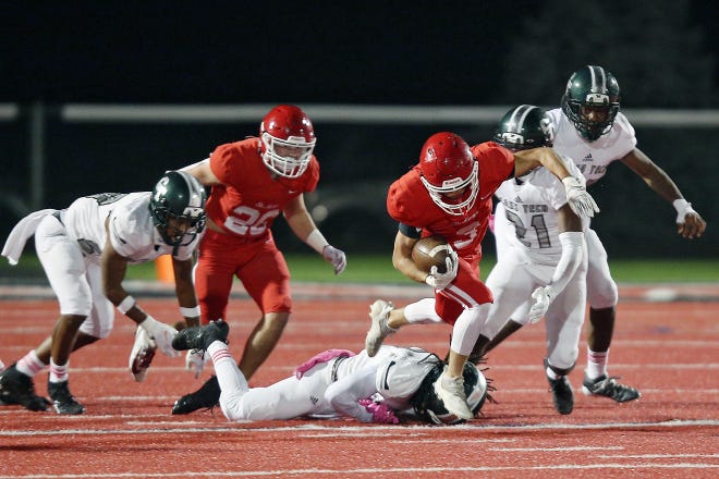 Orchard Lake St. Mary’s Jake Ruckhaber (3) breaks a tackle as he runs up the field during their high school football game against Detroit Cass Tech on Thursday, October 21, 2021 at Orchard Lake St. Mary's High School in West Bloomfield Township.