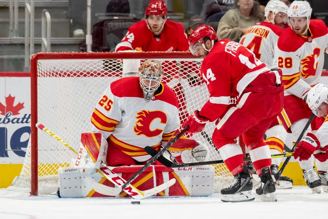 Detroit center Robby Fabbri tries to get the puck past Calgary goaltender Jacob Markstrom during the second period of a game between the Detroit Red Wings and the Calgary Flames, at Little Caesars Arena, in Detroit, October 21, 2021.