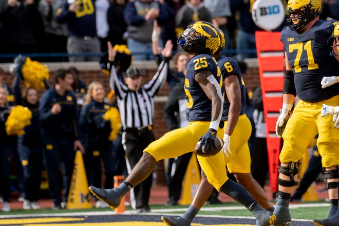 Michigan running back Hassan Haskins celebrates after scoring a touchdown during the third quarter.