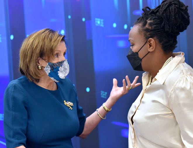US House Speaker Nancy Pelosi, left, talks with Mothering Justice National Executive Director and Founder Danielle Atkinson after the roundtable meeting, Saturday afternoon October 23, 2021.
