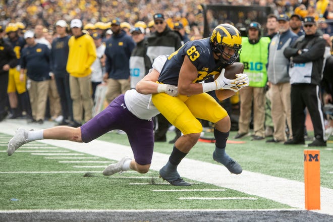 Michigan tight end Erick All is tackled by Northwestern linebacker Bryce Gallagher before the end zone during the second quarter.