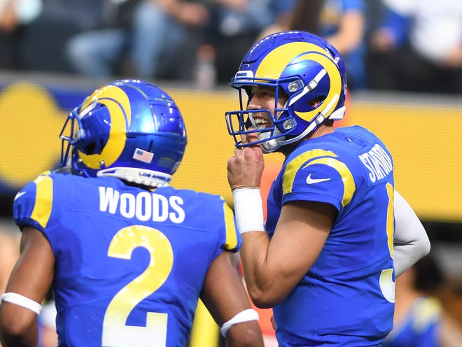 Rams quarterback Matthew Stafford smiles after a touchdown by teammate Robert Woods gives him 300 career touchdown passes, late in the second quarter.