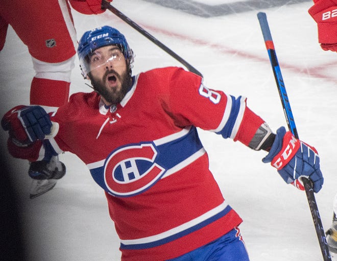 Montreal Canadiens' Mathieu Perreault reacts after scoring against the Detroit Red Wings during the second period.
