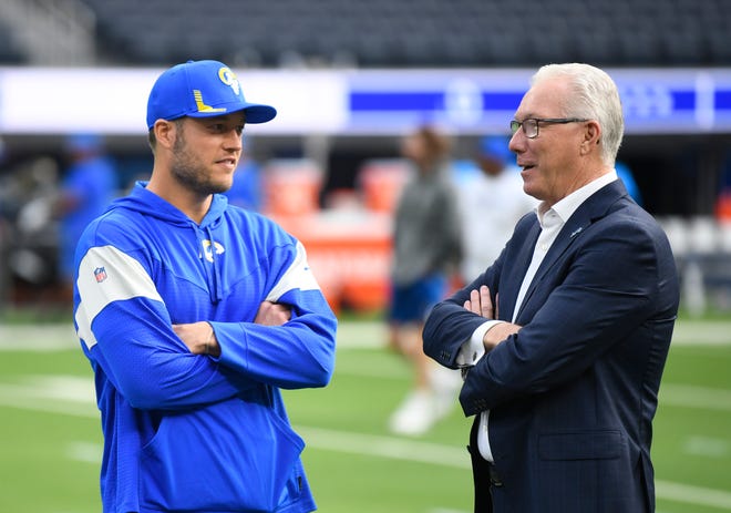 Rams quarterback Matthew Stafford talks with Lions president and CEO Rod Wood before Stafford takes on his former team.