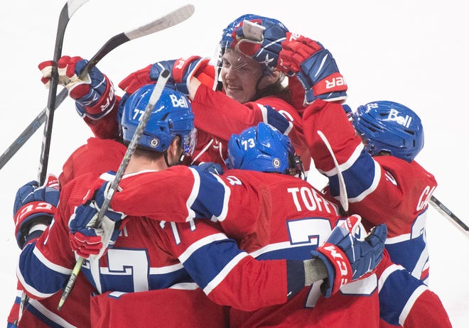 Montreal Canadiens celebrate a goal by Mathieu Perreault against the Detroit Red Wings during the second period.