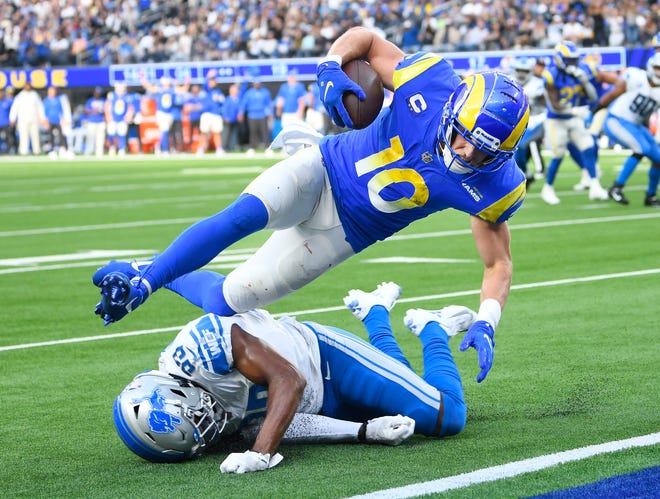 Rams receiver Cooper Kupp goes into the end zone over Lions defensive back Daryl Worley in the fourth quarter for the go-ahead touchdown late in the second half Sunday at SoFi Stadium. The Lions released Worley on Tuesday.