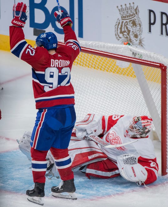 Canadiens' Jonathan Drouin reacts to a goal by teammate Christian Dvorak against Red Wings goaltender Thomas Greiss during the second period.