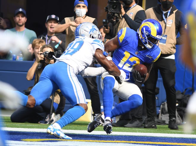 Lions defensive back Jerry Jacobs can't stop a touchdown reception by Rams receiver Van Jefferson in the second quarter.