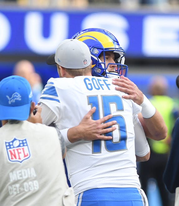 Lions quarterback Jared Goff and Rams quarterback Matthew Stafford hug before the coin toss.