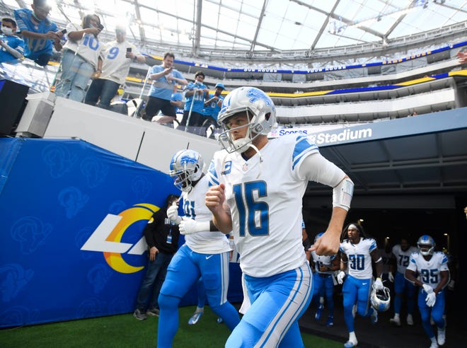 Lions quarterback Jared Goff and his teammates make their way onto the field to go against his former team the Los Angeles Rams, quarterbacked by former Detroit Lion Matthew Stafford.