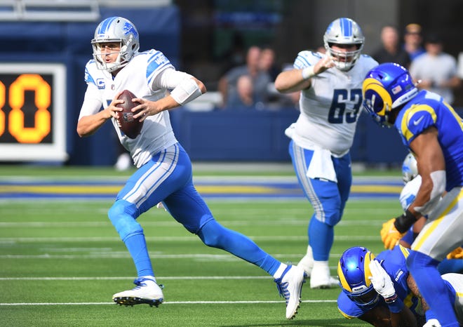 Lions quarterback Jared Goff breaks out of pressure in the third quarter.