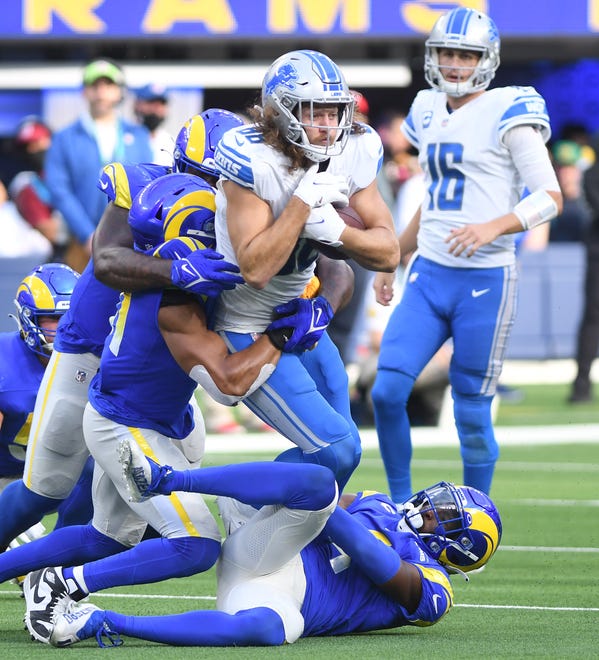 Lions T.J. Hockenson is brought down by the Rams defense in the fourth quarter.