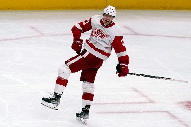 Red Wings left wing Lucas Raymond celebrates his hat trick against the Blackhawks during the third period.
