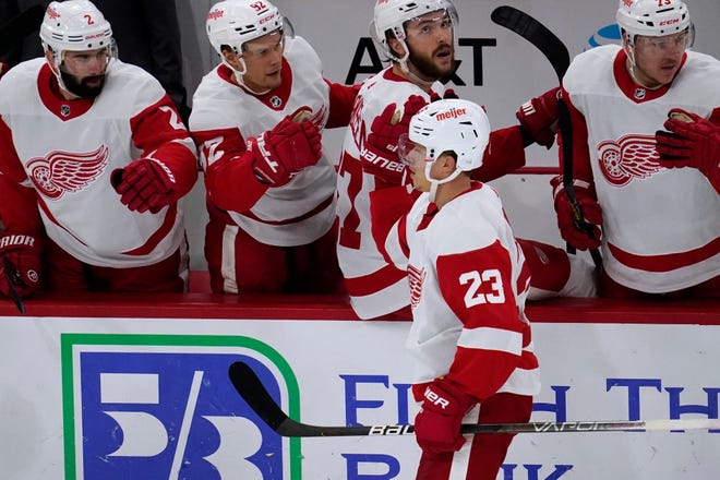 Red Wings left wing Lucas Raymond (23) celebrates with teammates after scoring a goal against the Blackhawks during the first period. The rookie notched a hat trick and added an assist in Detroit's 6-3 victory over the Blackhawks.