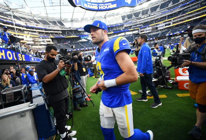 Rams quarterback Matthew Stafford leaves the field with a 25-19 victory over his former team, the Detroit Lions.