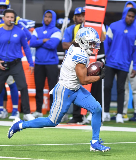 Lions' Khalif Raymond heads up field for a first down on a fake punt in the third quarter.