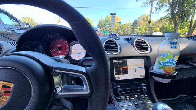 The 2021 Porsche Cayman GTS doesn't have console cupholders - but pop-out cupholders from the dash. They are mismatched for the 2021 Porsche Cayman GTS's high-G-load handling.