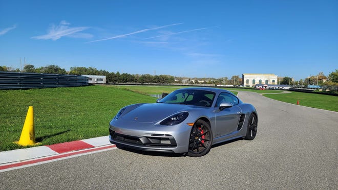 Through the fast, blind, uphill Turn 8 at M1 Concourse, the 2021 Porsche Cayman GTS stays flat, predictable with the throttle to the floor.