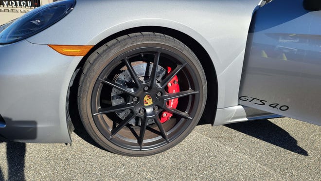 The 2021 Porsche Cayman GTS features big Brembo brakes. The GTS 4.0 badge refers to the 4.0-liter flat-6 engine amidships.