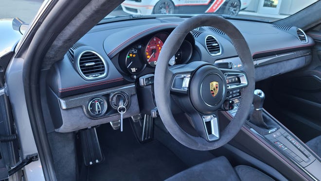 Where's the key? Jump into the 2021 Porsche Cayman GTS and the key is to the left of the wheel - just like the Le Mans race cars of yore.