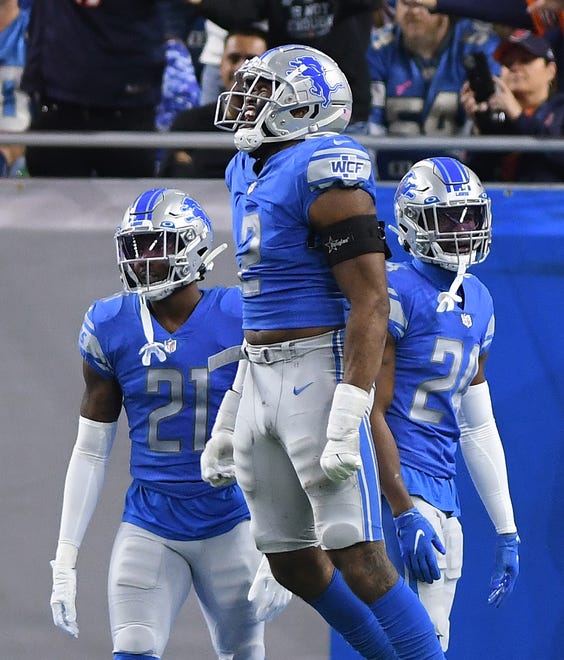 Lions' Austin Bryant leaps in the air and yells out after Bears' Jimmy Graham pulls in a touchdown reception in the end zone in the second quarter at Ford Field in Detroit, Michigan on November 25, 2021.