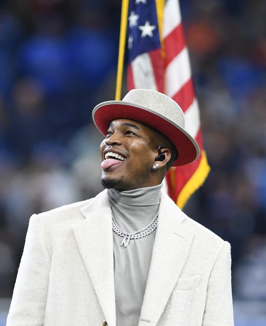 Ne-yo sings the National Anthem before the Lions, Bears game in Detroit.