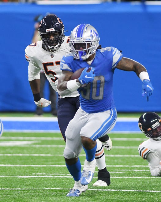 Lions running back Jamaal Williams heads up field in the fourth quarter.