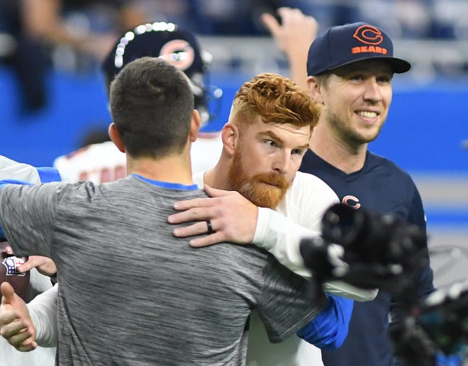 Chicago Bears quarterback Andy Dalton greets Lions players on the field before the game against the Detroit Lions.